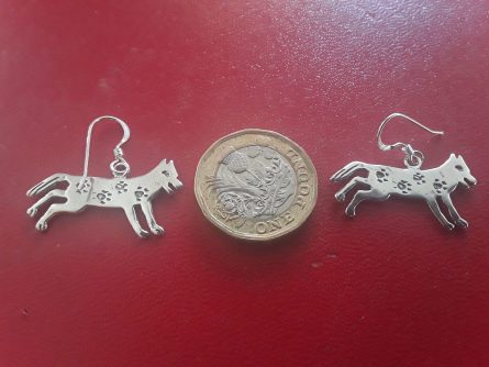 Silver running wolf earrings with paw prints 1