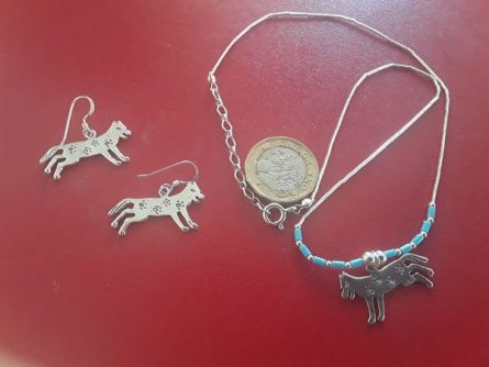 Silver running wolf jewellery with paw prints 1