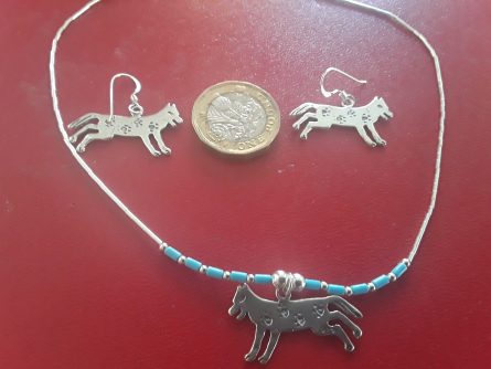 Silver running wolf jewellery with paw prints 2