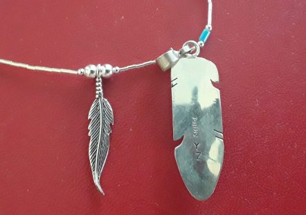 Feather earrings and nlace both styles rear of feathers